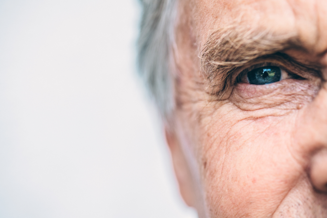 close up of senior caucasian man with blue eyes